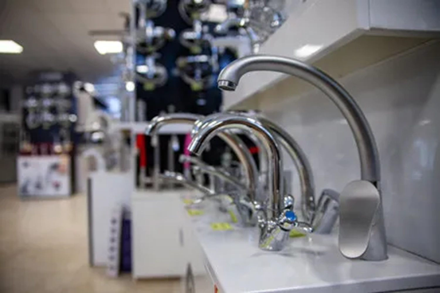 Kitchen water taps on display in a showroom